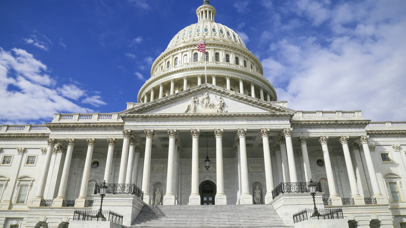 The United States Capitol under a blue sky